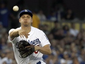 Los Angeles Dodgers shortstop Corey Seager throws out San Diego Padres' Austin Hedges at first base during the fourth inning of a baseball game in Los Angeles, Saturday, Aug. 12, 2017. (AP Photo/Alex Gallardo)