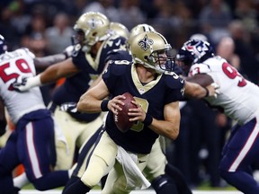New Orleans Saints quarterback Drew Brees (9) scrambles in the first half of a preseason NFL football game against the Houston Texans in New Orleans, Saturday, Aug. 26, 2017. (AP Photo/Butch Dill)