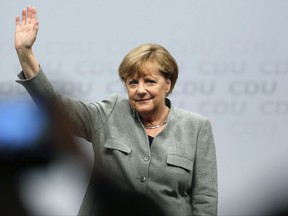 German Chancellor and top candidate of the Christian Democratic Union, CDU, for the upcoming general election Angela Merkel waves during the start of her election campaign in Dortmund, western Germany, Saturday, Aug. 12, 2017. (Ina Fassbender/dpa via AP)