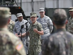 U.S. Pacific Command Commander Adm. Harry Harris, center, answers a reporter's question as U.S. and South Korean soldiers listen during a press conference as Lt. Gen. Samuel A. Greaves, director of the United States Missile Defense Agency, left, Gen. John Hyten, commander of the United States Strategic Command, second from right, United States Forces Korea Commander Gen. Vincent Brooks, right, listen at Osan Air Base in Pyeongtaek, South Korea, Tuesday, Aug. 22, 2017. (AP Photo/Lee Jin-man, Pool)