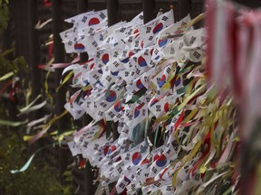 South Korean national flags and ribbons carrying messages to wish for the reunification of the two Koreas, flutter at the Imjingak Pavilion in Paju, South Korea, Wednesday, Aug. 16, 2017. China has urged the United States and North Korea to "hit the brakes" on threatening words and work toward a peaceful resolution of their tense standoff created by Pyongyang's recent missile tests and threats to fire them toward Guam. The dispute has also raised fears in South Korea, where a conservative political party on Wednesday called for the United States to bring back tactical nuclear weapons to the Korean Peninsula. (AP Photo/Lee Jin-man)