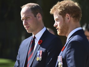 FILE - This is a Sunday, April 9, 2017, file photo of Britain's Prince William,  left, and Britain's Prince Harry as they arrive at the Canadian National Vimy Memorial in Vimy, near Arras, northern France, to attend the commemorations of the 100th anniversary of the Battle of Vimy Ridge. Princes William and Harry have spoken candidly about the death of their mother, Princess Diana, in an interview marking 20 years since she was killed in a car crash.  (Philippe Huguen/Pool Photo, File via AP)
