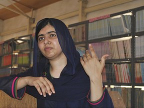 FILE - A Tuesday, July. 18, 2017 file photo of Nobel Peace laureate, Malala Yousafzai, gesturing, during a visit to school in Maiduguri Nigeria. Malala Yousafzai has gained a place at the University of Oxford. The 20-year-old education activist tweeted her acceptance to the school, saying she was "so excited" to win a spot to study philosophy, politics and economics. (AP Photo/ Jossy Ola, File)