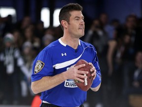 FILE - In this Saturday, Feb. 1, 2014 file photo, Jesse Palmer, former New York Giants quarterback, looks to pass during the Direct TV Beach Bowl at Pier 40, in New York. The Daily Mail is branching into television, hiring ESPN football analyst Jesse Palmer to host a daily U.S. syndicated show starting next month, it was announced on Monday, Aug. 14, 2017. The New York-based show seeks to replicate the blend of news, sensation, human interest and entertainment that has made the brand's online offering a trans-Atlantic success. (AP photo/John Minchillo, file)