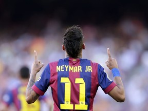 FILE- In this Saturday, May 9, 2015 file photo, FC Barcelona's Neymar celebrates after scoring against Real Sociedad during a Spanish La Liga soccer match at the Camp Nou stadium in Barcelona, Spain. Barcelona said Wednesday, Aug. 2, 2017, Neymar's 222 million euro ($262 million) release clause must be paid in full if the Brazil striker wants to leave. (AP Photo/Manu Fernandez, File)