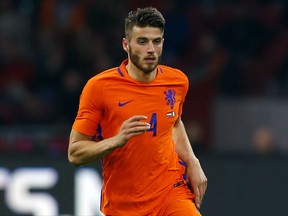 FILE - In this Thursday, March 30, 2017 file photo, Netherlands' Wesley Hoedt plays the ball during their international friendly soccer match against Italy at the Amsterdam ArenA stadium, Netherlands. Southampton has signed Wesley Hoedt from Lazio, it was announced on Tuesday, Aug. 22, and provided fresh evidence of its determination to retain his Netherlands teammate, Virgil van Dijk. Despite handing in a transfer request, van Dijk's attempts to leave the Premier League club have been rebuffed. (AP Photo/Peter Dejong)