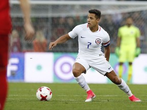 FILE - In this Friday, June 9, 2017 file photo, Chile's Alexis Sanchez during the international friendly soccer match between Russia and Chile at the VEB Arena stadium in Moscow.  Sanchez, who was Arsenal's leading scorer with 30 goals last season, may decide his future lies away from north London despite efforts from Arsene Wenger to hold onto him as Arsenal attempts to return to the Champions League. (AP Photo/Pavel Golovkin, FILE)