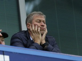 Chelsea soccer club owner Roman Abramovich sits in his box before the English Premier League soccer match between Chelsea and Sunderland at Stamford Bridge stadium in London in December 2015.  According to a joint statement Monday Aug. 7, 2017, 50-year old Russian tycoon Roman Abramovich and his wife Dasha Zhukova have announced their impending divorce, after ten years together.