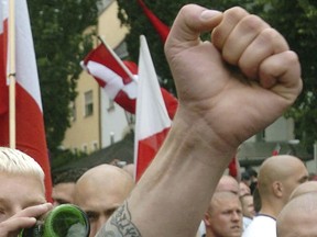 In this file photo dated Saturday, Aug. 21, 2004, Neo-Nazi sympathizers demonstrate prior to the beginning of a commemoration march for Adolf Hitler's deputy Rudolf Hess in the northeastern Bavarian town of Wunsiedel where Hess is buried.