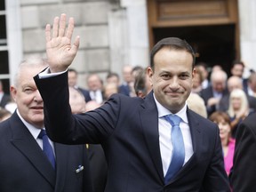 FILE - A Wednesday, June 14, 2017 file photo of Ireland's new Prime Minister Leo Varadkar waving after being elected Ireland's 14th Taoiseach (Prime Minister) at Leinster House, Dublin, Ireland. The EU bloc's chief negotiator, Michel Barnier, said last month there was "a clock ticking" on the Brexit talks. Irish Prime Minister Leo Varadkar said last week that Brexit advocates "already had 14 months" to issue detailed proposals, but had not. (AP Photo/Peter Morrison, File)