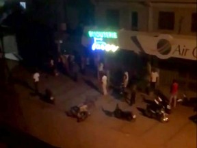 This image taken from video, early Monday, Aug. 14, 2017, shows a top shot of a street near a Turkish restaurant that came under an attack in Ouagadougou. Suspected Islamic extremists opened fire at a Turkish restaurant in the capital of Burkina Faso late Sunday, killing at least 18 people in the second such attack on a restaurant popular with foreigners in the last two years. (El Hadji Macky Diouf via AP)
