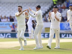 England's James Anderson celebrates after taking the wicket of West Indies Shai Hope during day three of the the second cricket Test Match England versus West Indies at Headingley, Leeds, England, Sunday Aug. 27, 2017. (Nigel French/PA via AP)