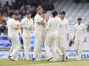 England's Stuart Broad, fourth left, celebrates after taking the wicket of West Indies' Kieran Powell during day five of the the second cricket Test match at Headingley cricket ground, Leeds, England Tuesday Aug. 29, 2017.  (Nigel French/PA via AP)