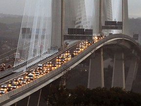 Traffic flows on both carriageways of the Queensferry Crossing this morning after it opened to traffic for the first time, Wednesday, Aug. 30, 2017, in Queensferry, Scotland. The new bridge, which crosses the Firth of Forth, is the world's longest three tower cable-stay bridge. (Andrew Milligan/PA via AP)