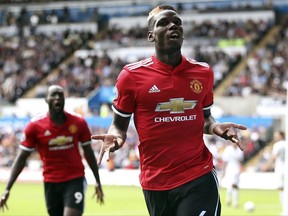 Manchester United's Paul Pogba celebrates scoring his side's third goal, during the English Premier League soccer match between Swansea and Manchester United, at the Liberty Stadium, in Swansea, Wales, Saturday Aug. 19, 2017. (Nick Potts/ PA via AP)