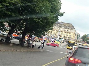 Turku Market Square on Friday, Aug. 18, 2017, with a yellow ambulance on the corner of the square (behind red car). Police in Finland say they have shot a man in the leg after he was suspected of stabbing several people in the western city of Turku. (Lehtikuva via AP)