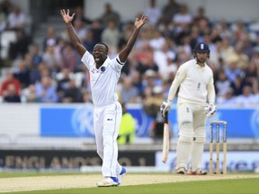 West Indies Kemar Roach celebrates the wicket of England's Mark Stoneman during the second Test match at Headingley, Leeds, England, Friday Aug. 25, 2017. (Nigel French/PA via AP)