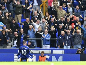 Everton's Wayne Rooney celebrates scoring his side's first goal against Stoke City during the English Premier League soccer match at Goodison Park, Liverpool, England, Saturday, Aug. 12, 2017. (Anthony Devlin/PA via AP)