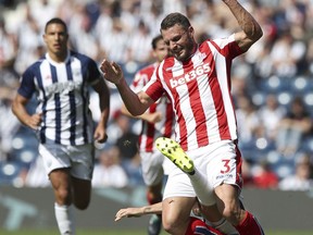West Bromwich Albion's Jay Rodriguez and Stoke City's Rodriguez Jese battle for the ball during their English Premier League soccer match at The Hawthorns, West Bromwich, England, Sunday Aug. 27, 2017. (Nick Potts/PA via AP)