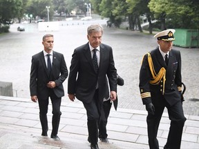 President of Finland Sauli Niinist, centre, arrives for a prayer service for stabbing victims at the Cathedral in Turku, Finland, on Friday evening, Aug. 18, 2017.  Several people were stabbed on the Market Square earlier Friday. (Vesa Moilanen/Lehtikuva via AP)