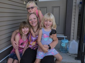 Louise Hutchison, centre, and her granddaughters Coralynn, left, nine, Riley, top, six, and Hayleigh, three, at their home in Airdrie, Alta., Thursday, July 27, 2017.