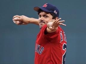 Actor Casey Affleck delivers a ceremonial first pitch prior to a baseball game between the Boston Red Sox and St. Louis Cardinals in Boston, Tuesday, Aug. 15, 2017. (AP Photo/Charles Krupa)