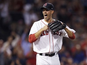 Boston Red Sox starting pitcher Rick Porcello reacts after his infield turned a triple play during the fourth inning of a baseball game against the St. Louis Cardinals in Boston, Tuesday, Aug. 15, 2017. (AP Photo/Charles Krupa)