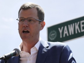 FILE - In this June 22, 2017, file photo, Boston Red Sox president Sam Kennedy addresses a gathering where a portion of Yawkey Way was renamed David Ortiz Drive, to honor the retired Red Sox designated hitter, outside Fenway Park in Boston. Red Sox principal owner John Henry says he wants to take steps to rename all of Yawkey Way, a street that has been an enduring reminder of the franchise's complicated racial past. (AP Photo/Charles Krupa, File)