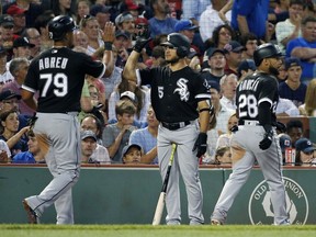Chicago White Sox's Jose Abreu (79) celebrates with Yolmer Sanchez (5) after scoring with Leury Garcia (28) on a two-run double by Nicky Delmonico during the fourth inning of a baseball game against the Boston Red Sox in Boston, Friday, Aug. 4, 2017. (AP Photo/Michael Dwyer)