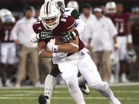 Massachusetts' Adam Breneman makes a reception as Hawaii's Daniel Lewis Jr. defends during the first quarter of an NCAA college football game Saturday, Aug. 26, 2017, in Amherst, Mass. (J. Anthony Roberts/The Republican via AP)