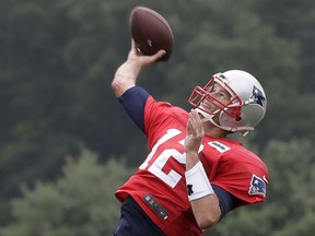 New England Patriots quarterback Tom Brady passes the ball at NFL football training camp, Thursday, Aug. 3, 2017, in Foxborough, Mass. Brady turned 40-years-old Thursday. (AP Photo/Steven Senne)