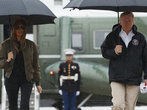 President Donald Trump and first lady Melania Trump walk from Marine One to board Air Force One at Andrews Air Force Base, Md.,  Tuesday, Aug. 29, 2017, for a trip to Texas to get an update on Harvey relief efforts.  (AP Photo/Evan Vucci)