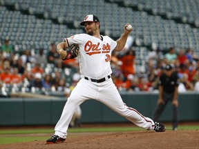 Baltimore Orioles starting pitcher Wade Miley throws to the Oakland Athletics in the first inning of a baseball game in Baltimore, Monday, Aug. 21, 2017. (AP Photo/Patrick Semansky)