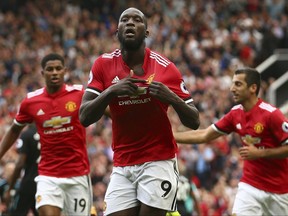 Manchester United's Romelu Lukaku celebrates scoring his side's first goal of the game during the English Premier League soccer match between Manchester United and West Ham United at Old Trafford in Manchester, England, Sunday, Aug. 13, 2017. (AP Photo/Dave Thompson)
