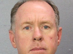 This undated photo provided by the Broward Sheriff's Office shows Broward Deputy Michael Dingman, who was charged with copying a videotape of a mass shooting at Fort Lauderdale's airport and leaking it to the website TMZ, Wednesday, Aug. 16, 2017, in Fort Lauderdale, Fla. The Broward County sheriff's office says Deputy Michael Dingman was arrested Wednesday after being accused of leaking to TMZ surveillance video of Esteban Santiago fatally shooting five people and wounding six others last Jan. 6 at Fort Lauderdale-Hollywood International Airport. (Broward Sheriff's Office via AP)