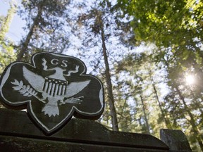 FILE - This Monday, Sept. 22, 2014 file photo shows the official Girl Scouts crest at the entrance of a Girl Scout Camp in Lapeer, Mich. As of March 2017, GSUSA reported 1,566,671 youth members and 749,008 adult members -- down from just over 2 million youth members and about 800,000 adult members in 2014. (Erin Kirkland/The Flint Journal-MLive.com via AP)