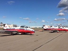 The Snowbirds jets sit parked on the tarmac following a performance at CFB Greenwood in Greenwood, N.S., on Saturday, August 27, 2017. Fire trucks were on hand at a military air base in Nova Scotia after one of the planes flown by the Snowbird aerobatic team appeared to catch fire on the runway. The nine-plane team was taking part in the Atlantic Canada International Air Show at CFB Greenwood on Saturday.