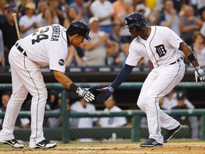 Detroit Tigers' Justin Upton, right, celebrates his solo home run with Miguel Cabrera (24) against the Los Angeles Dodgers in the fourth inning of a baseball game in Detroit, Friday, Aug. 18, 2017. (AP Photo/Paul Sancya)