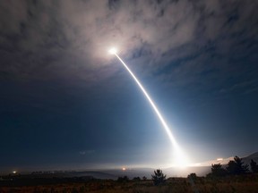In this image taken with a slow shutter speed and provided by Vandenberg Air Force Base, an unarmed Minuteman 3 missile launches from Vandenberg Air Force Base, Calif.,  Wednesday, Aug. 2, 2107.