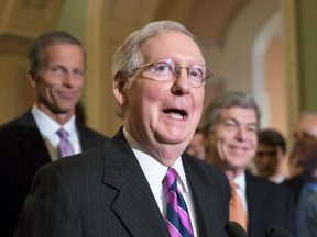 The rupture between Donald Trump and Sen. Mitch McConnell, above centre, comes at a highly perilous moment for Republicans.