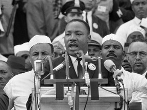 In this Aug. 28, 1963 photo, Dr. Martin Luther King Jr., addresses marchers during his "I Have a Dream" speech at the Lincoln Memorial in Washington. 