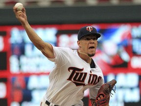 Minnesota Twins pitcher Jose Berrios (17) throws to the Texas Rangers in the first inning of a baseball game on Sunday, Aug. 6, 2017, in Minneapolis. (AP Photo/Andy Clayton-King)