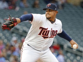 Minnesota Twins starting pitcher Adalberto Mejia throws to the Texas Rangers in the first inning of a baseball game Thursday, Aug. 3, 2017, in Minneapolis. (AP Photo/Bruce Kluckhohn)