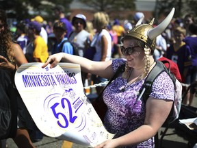 Melissa Hinton of Mankato waits in line for an autograph on the last day of Minnesota Vikings training camp, Tuesday, Aug. 8, 2017 in Mankato, Minn. (Jerry Holt/Star Tribune via AP)