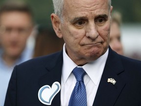 Gov. Mark Dayton arrives for a memorial service for Justine Damond Friday, Aug. 11, 2017, at Lake Harriet in Minneapolis. Damond was fatally shot by a Minneapolis police officer on July 15 after she called 911 to report a possible sexual assault near her home.  (Anthony Souffle/Star Tribune via AP)