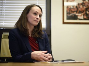 FILE - In this Feb. 13, 2017, file photo, Missouri's first lady and University of Missouri Assistant Professor Sheena Greitens sits at her desk for an interview in Columbia, Mo. Missouri's child abuse hotline now accepts out-of-state calls after Greitens learned that wasn't previously the case when reviewing a report from 2014. (Luke Brodarick /Missourian via AP, File)