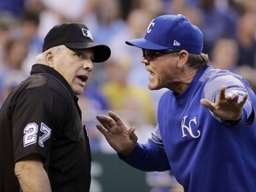 Kansas City Royals manager Ned Yost argues with home plate umpire Larry Vanover after losing a challenge of a home run by Seattle Mariners' Danny Valencia during the fourth inning of a baseball game Thursday, Aug. 3, 2017, in Kansas City, Mo. Yost was ejected from the game. (AP Photo/Charlie Riedel)