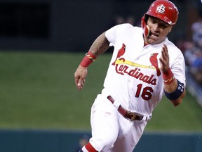 St. Louis Cardinals' Kolten Wong rounds third and heads home to score on a single by Randal Grichuk during the second inning of a baseball game against the Atlanta Braves on Friday, Aug. 11, 2017, in St. Louis. (AP Photo/Jeff Roberson)