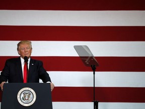 President Donald Trump pauses while speaking about on tax reform, Wednesday, Aug. 30, 2017, at the Loren Cook Company in Springfield, Mo. (AP Photo/Jeff Roberson)