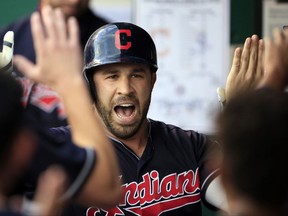 Cleveland Indians' Jason Kipnis celebrates his solo home run with teammates during the first inning of a baseball game against the Kansas City Royals at Kauffman Stadium in Kansas City, Mo., Friday, Aug. 18, 2017. (AP Photo/Orlin Wagner)